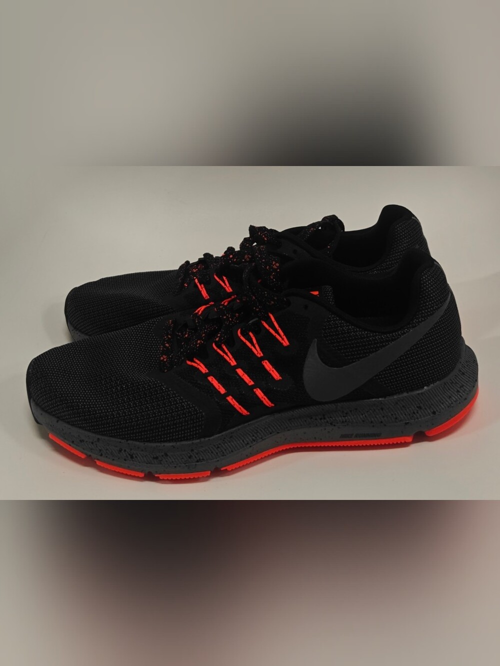 Nike Black Athletic Sneakers with Bright Orange Accents